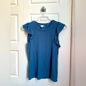 sleeveless blue shirt with ruffles on the arms